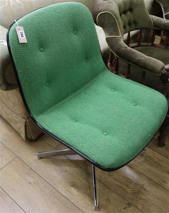 A green upholstered swivel chair